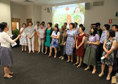 CSIRO members and friends singing  at the party