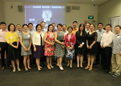 UQ members and friends singing  at the party