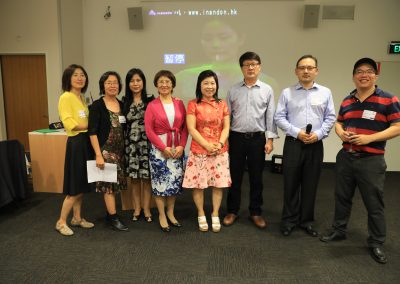 Griffith University members and friends singing  at the party